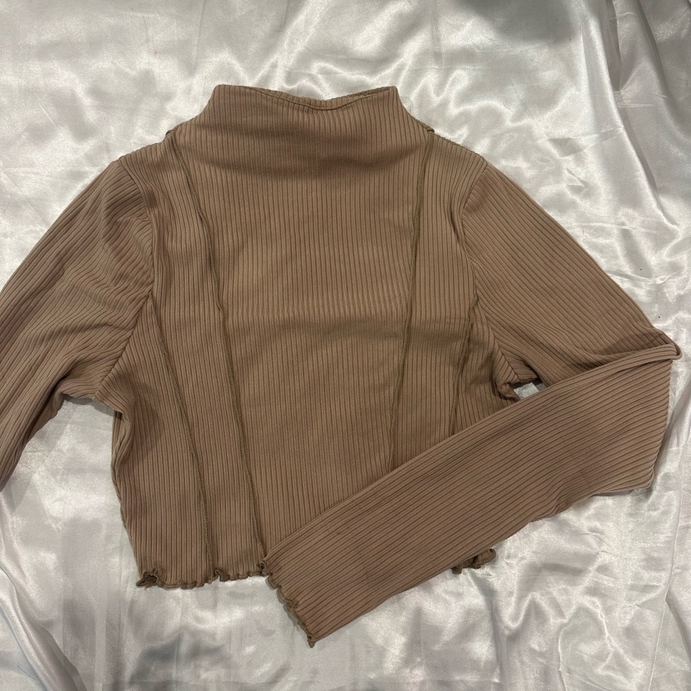 tan long sleeve crop top with lettuce leaf hem